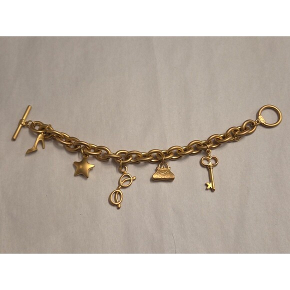 Victoria's Secret Jewelry - Victoria’s Secret Gold Tone Charm Bracelet VS Logo Missing Charm Toggle Closure